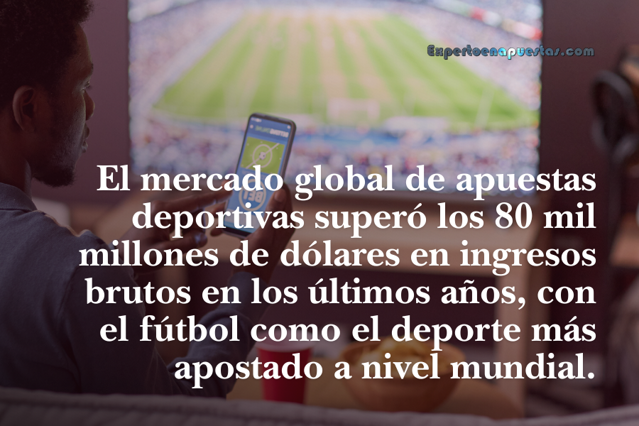 Apostador revisando apuestas deportivas en su teléfono mientras observa un partido de fútbol en pantalla grande.